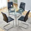Table and chair set. (1 table+4 black chairs) Round dining table with a 40 inch diameter glass tabletop and silver plated metal legs. 4 black PU chair