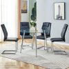 Table and chair set. (1 table+4 black chairs) Round dining table with a 40 inch diameter glass tabletop and silver plated metal legs. 4 black PU chair